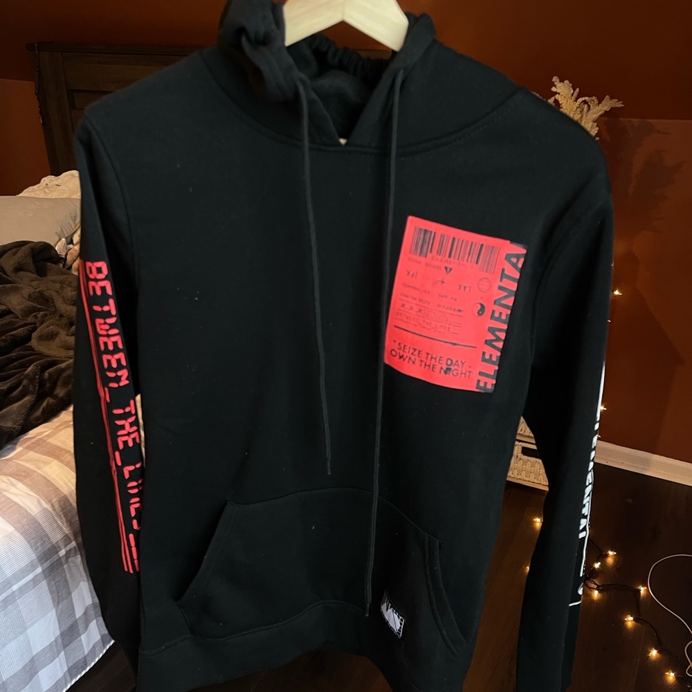Black hooded sweater.